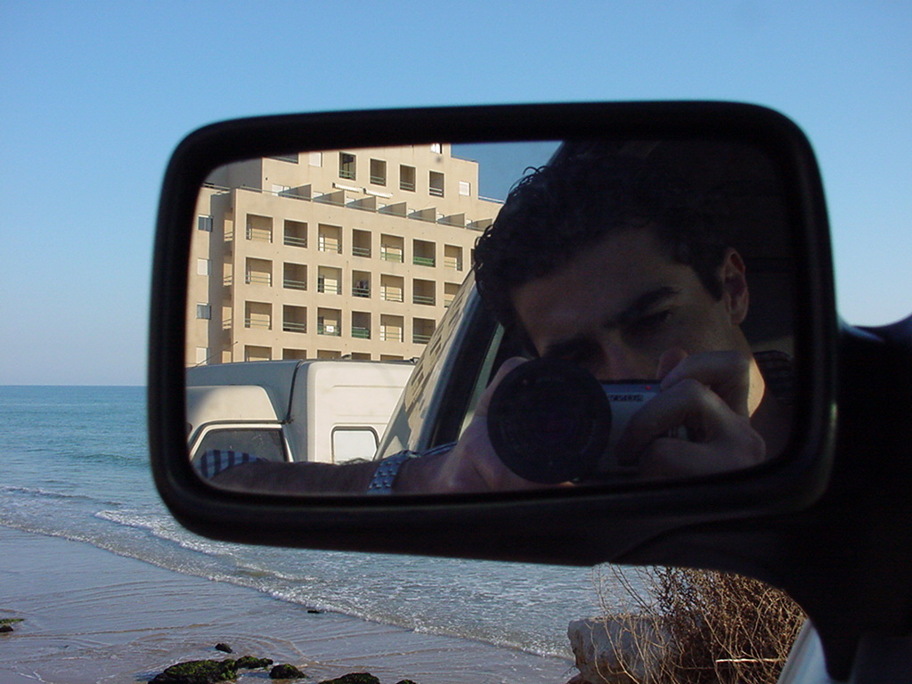 My first digital camera was a Sony Cyber-shot DSC-F505. Digital photography allowed me to explore new angles and experiment with shots freely, without worrying about the cost of developing each photo.This is me, at 22, in front of the beach where I used to park to read… and surf whenever the swell arrived.