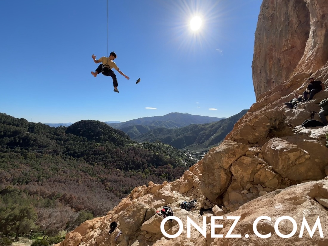 The Importance of Photography in Storytelling... In this picture, taken during a family climbing weekend, I captured my son after completing a challenging route. Here, we see him taking off his climbing shoes while heading down after finishing the climb.